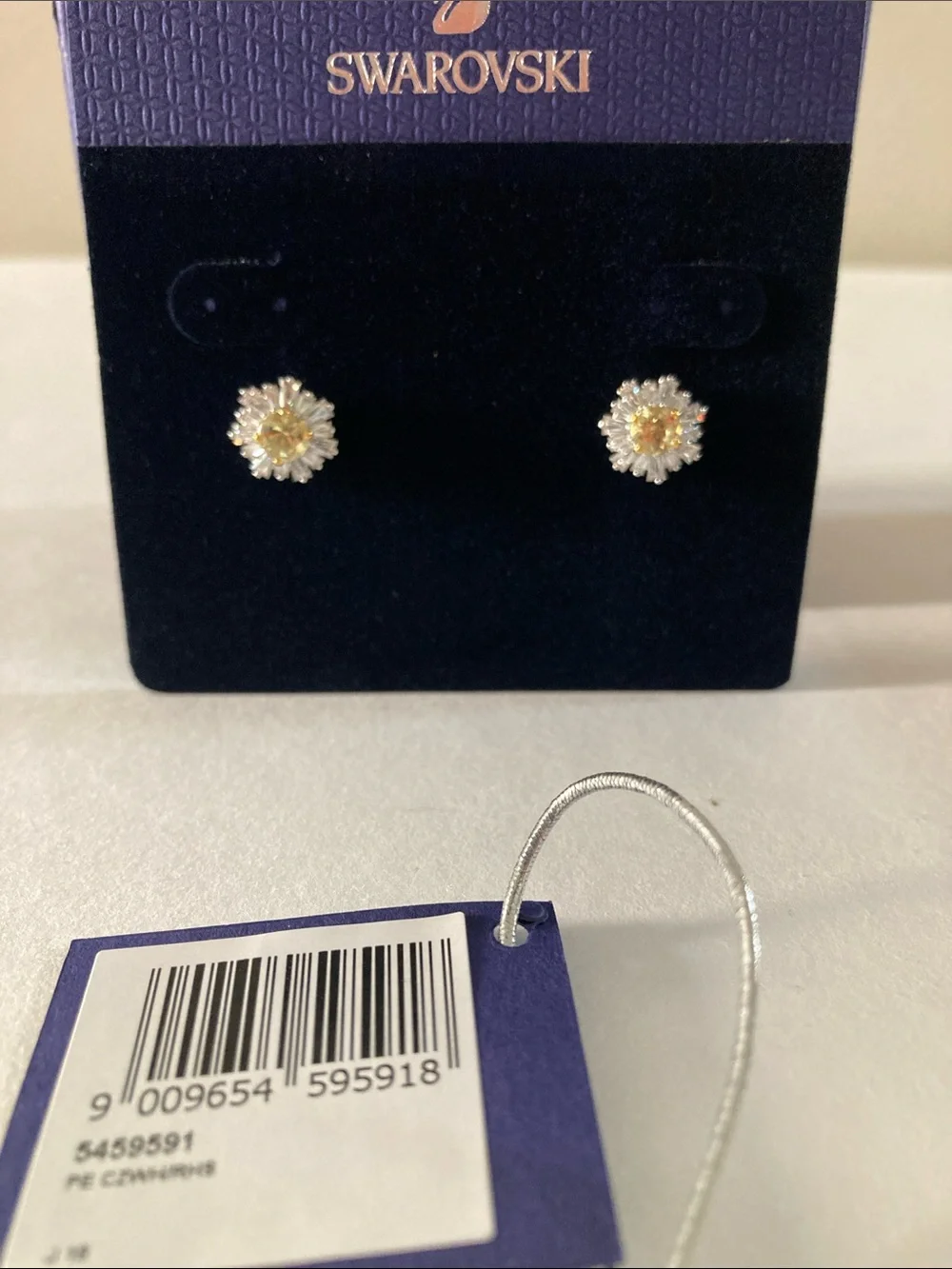 Swarovski crystal sunshine pierced earrings in rhodium plating